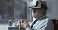 Excited businessman experiencing virtual reality