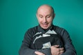 Excited businessman holding bag with money and smiling Royalty Free Stock Photo