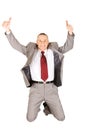 Excited businessman jumping with ok sign Royalty Free Stock Photo