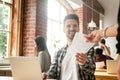 Smiling employee giving report to executive satisfied with work