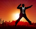 Excited businessman on sunset background