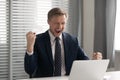 Excited businessman celebrating business success, achievement, shouting Royalty Free Stock Photo