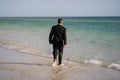 Excited businessman in wet suit run in sea. Funny business man, crazy comic business concept. Remote online working Royalty Free Stock Photo