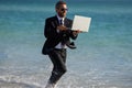 Excited businessman in wet suit run in sea. Funny business man, crazy comic business concept. Remote online working Royalty Free Stock Photo