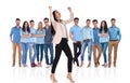 Excited businesswoman celebrating while standing in front of her