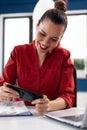 Excited businesswoman having fun at wwork playing video games