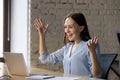 Excited businesswoman using laptop, celebrate business achievement