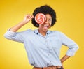 Excited, candy and lollipop with black woman in studio for colorful, cheerful and positive. Young, happiness and dessert