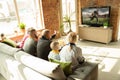 Excited family watching american football, sport match at home Royalty Free Stock Photo