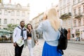 Excited cheerful mix raced couple, African man and Caucasian girl, enjoying walking outdoors, in the center of ancient Royalty Free Stock Photo