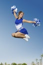 Excited Cheerleader Jumping Royalty Free Stock Photo