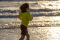 Excited child playing in the sea. Kid having fun outdoors. Summer vacation and healthy lifestyle concept. Cute kids Royalty Free Stock Photo