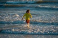 Excited child playing in the sea. Kid having fun outdoors. Summer vacation and healthy lifestyle concept. Cute kids Royalty Free Stock Photo