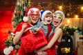 Excited Christmas brother and sister. Happy little child dressed in winter clothing think about Santa near Christmas Royalty Free Stock Photo