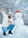 Excited Christmas chef cook. Snowman and funny bearded man in the snow kitchen. Joyful Father cook Having Fun with