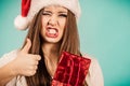 Excited christmas woman holds gift bag Royalty Free Stock Photo