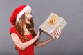 Excited Christmas Woman Wearing Santa Hat Surprised Of A Gift Royalty Free Stock Photo