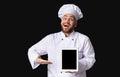 Excited Cook Guy Showing Tablet Screen Posing In Studio, Mockup Royalty Free Stock Photo