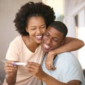 Excited Couple In Bedroom At Home Celebrating Positive Pregnancy Test Result Royalty Free Stock Photo