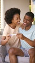 Excited Couple In Bedroom At Home Celebrating Positive Pregnancy Test Result Royalty Free Stock Photo