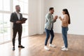 Excited Couple Buying New Apartment, Celebrating Successful Deal