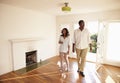 Excited Couple Explore New Home On Moving Day Royalty Free Stock Photo