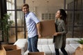 Excited couple moving to new apartment together Royalty Free Stock Photo