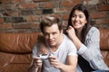 Excited couple playing video games together at home Royalty Free Stock Photo