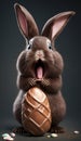 Excited cute Easter bunny eating an chocolate Easter egg Royalty Free Stock Photo