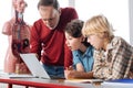 Excited determined students showing results to their teacher Royalty Free Stock Photo