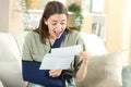 Excited disabled woman receiving good news on letter