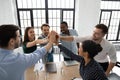 Excited diverse colleagues give high five celebrate success Royalty Free Stock Photo