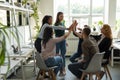 Excited diverse colleagues give high five motivated for shared success Royalty Free Stock Photo