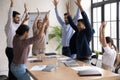 Excited diverse employees participate in teambuilding activity at meeting Royalty Free Stock Photo