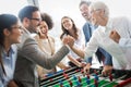 Excited diverse employees enjoying funny activity at work break, creative friendly workers play game Royalty Free Stock Photo