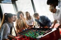 Excited diverse employees enjoying funny activity at work break, creative friendly workers play game Royalty Free Stock Photo