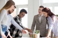 Excited diverse employees have fun brainstorming in office Royalty Free Stock Photo