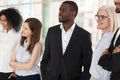 Excited diverse employees look in distance dreaming of success