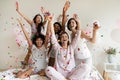 Excited diverse girls throwing confetti, celebrating at party Royalty Free Stock Photo