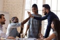 Excited diverse male employees give high five at briefing Royalty Free Stock Photo