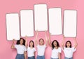 Excited diverse women showing five white empty smartphone screen Royalty Free Stock Photo