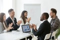 Excited diverse team applauding celebrating shared goal achievem Royalty Free Stock Photo