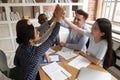 Excited diverse young people give high five showing unity Royalty Free Stock Photo