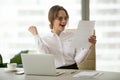 Excited employee reading letter with good news happy about promo Royalty Free Stock Photo