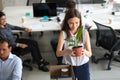 Excited employee settle at new workplace on first work day