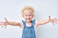 excited funny emotional blonde girl stretching arms for hug, looking at camera. Royalty Free Stock Photo