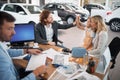 Excited family buying a new car.family celebrating just bought a new car Royalty Free Stock Photo