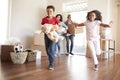 Excited Family Carrying Boxes Into New Home On Moving Day Royalty Free Stock Photo