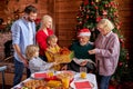 Excited family congratulating each other with chrstmas or new year