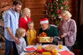 Excited family congratulating each other with chrstmas or new year